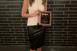 A photo of Jennifer Stairs posing with the Canadian Media Lawyers Association’s Freedom of Expression Award